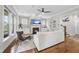 Comfortable living room with a fireplace, hardwood floors, and natural light from the window at 707 Sasser St, Raleigh, NC 27604