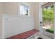 Functional mudroom with a bench, storage, and access to the outdoor area at 707 Sasser St, Raleigh, NC 27604