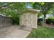 Outdoor storage shed nestled in a landscaped backyard, providing practical and secure storage solutions at 707 Sasser St, Raleigh, NC 27604