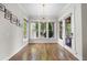 Sun-filled room with hardwood floors and a chandelier, perfect for relaxation at 707 Sasser St, Raleigh, NC 27604