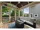 Relaxing sunroom with comfortable seating, a coffee table, and views of the surrounding greenery at 707 Sasser St, Raleigh, NC 27604