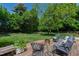 Backyard featuring a deck with outdoor furniture and a lush, green lawn at 713 E Whitaker Mill Rd, Raleigh, NC 27608