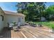 Backyard featuring a large deck with outdoor seating and a shed at 713 E Whitaker Mill Rd, Raleigh, NC 27608