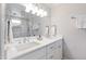 Bright bathroom with a double sink vanity and a glass enclosed shower at 713 E Whitaker Mill Rd, Raleigh, NC 27608