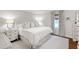 Serene bedroom with soft lighting, neutral decor, hardwood floors, and a comfortable queen-sized bed at 713 E Whitaker Mill Rd, Raleigh, NC 27608