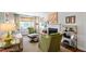 Comfortable living room with a fireplace, stylish seating, neutral rug, and window with natural light at 713 E Whitaker Mill Rd, Raleigh, NC 27608