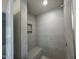 Modern tiled shower with built-in shelving and a sleek design at 776 Old Station Pointe, Angier, NC 27501