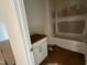 This bathroom has a bathtub, a vanity with drawers, and lighting at 776 Old Station Pointe, Angier, NC 27501