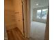 Bedroom with neutral carpet, large windows, and attached bathroom at 776 Old Station Pointe, Angier, NC 27501