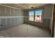 Unfinished bedroom showcasing a view of the neighborhood from the windows at 776 Old Station Pointe, Angier, NC 27501