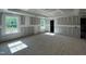 Spacious unfinished bedroom featuring natural light and a door at 776 Old Station Pointe, Angier, NC 27501