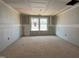 Bright bedroom showcasing its potential, featuring ample natural light from its well-placed windows at 776 Old Station Pointe, Angier, NC 27501