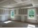Unfinished bedroom with abundant natural light streaming in from large windows at 776 Old Station Pointe, Angier, NC 27501