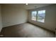 Clean, bright bedroom with neutral carpet and a double window that offers plenty of natural light at 776 Old Station Pointe, Angier, NC 27501