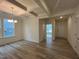 Well-lit dining area with hardwood floors and detailed coffered ceiling at 776 Old Station Pointe, Angier, NC 27501