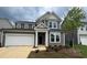 Charming two-story home with attached garage and landscaped front yard at 776 Old Station Pointe, Angier, NC 27501