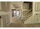 View of open foyer with staircase and views to other rooms at 776 Old Station Pointe, Angier, NC 27501