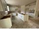 Modern kitchen featuring white cabinets, a center island with drawers, and lots of space for food prep at 776 Old Station Pointe, Angier, NC 27501