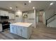 Kitchen with a center island, white cabinets and stainless steel appliances at 776 Old Station Pointe, Angier, NC 27501