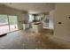 Modern kitchen featuring white cabinets, a center island, and sliding glass door access to the outside at 776 Old Station Pointe, Angier, NC 27501