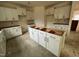Modern kitchen featuring white cabinets, a center island with drawers, and lots of space for food prep at 776 Old Station Pointe, Angier, NC 27501