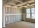 Spacious living room features a coffered ceiling and bright windows at 776 Old Station Pointe, Angier, NC 27501
