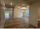 Bright, open-concept living room featuring hardwood floors and coffered ceiling at 776 Old Station Pointe, Angier, NC 27501