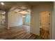 Open living space featuring hardwood floors and views to the bathroom and kitchen at 776 Old Station Pointe, Angier, NC 27501