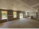 Large living room featuring coffered ceilings and sliding glass doors at 776 Old Station Pointe, Angier, NC 27501