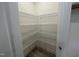 Walk-in pantry features wire shelving for ample storage at 776 Old Station Pointe, Angier, NC 27501