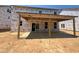 Unfinished covered patio area with exposed wood frame construction and sliding glass doors at 776 Old Station Pointe, Angier, NC 27501