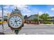Charming street view showcasing Angier Centennial clock and historic architecture under a sunny sky at 776 Old Station Pointe, Angier, NC 27501