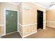Hallway with an elevator and apartment doors at 8231 Allyns Landing Way # 302, Raleigh, NC 27615