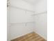 Walk-in closet with carpet and metal storage shelving on three levels along the walls at 8231 Allyns Landing Way # 302, Raleigh, NC 27615