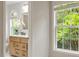 Bathroom featuring vanity, updated counters, with a view to a window at 8814 Waynick Dr, Raleigh, NC 27617