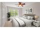 Bedroom with ceiling fan, one window, neutral carpet and paint, and double closet at 8814 Waynick Dr, Raleigh, NC 27617
