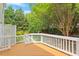 Exterior view of the deck featuring wood flooring and white railings at 8814 Waynick Dr, Raleigh, NC 27617
