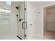 Updated shower with frameless glass, bench seat and modern fixtures at 8814 Waynick Dr, Raleigh, NC 27617