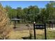 Dog park with multiple shade covers and agility equipment, designed exclusively for residents of Kensley Grove at 908 Kensley Grove Lane St #69, Fuquay Varina, NC 27526