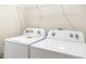 A well-equipped laundry room with a modern, white washer and dryer set for convenient chores at 908 Kensley Grove Lane St #69, Fuquay Varina, NC 27526
