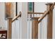 Staircase features wood railing and white risers at 908 Kensley Grove Lane St #69, Fuquay Varina, NC 27526