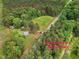 Approximate boundaries of a property featuring a house, outbuildings, trees, pasture and road at 9652 S Nc-87 Hwy, Graham, NC 27253