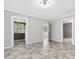 Open dining room with decorative flooring and access to other rooms at 9652 S Nc-87 Hwy, Graham, NC 27253