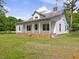 Traditional one story home with covered porch perfect for relaxing outdoors at 9652 S Nc-87 Hwy, Graham, NC 27253