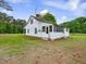 Charming single-story home featuring a well-maintained lawn and a screened in porch at 9652 S Nc-87 Hwy, Graham, NC 27253