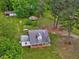 Charming home featuring a welcoming front porch and a spacious, tree-filled yard at 9652 S Nc-87 Hwy, Graham, NC 27253