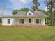 Lovely one-story home featuring a welcoming front porch and spacious front yard at 9652 S Nc-87 Hwy, Graham, NC 27253