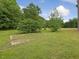 Beautifully maintained lawn is ideal for outdoor activities or simply enjoying the serene surroundings at 9652 S Nc-87 Hwy, Graham, NC 27253