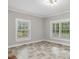Bright room with big windows, light gray walls, and decorative flooring at 9652 S Nc-87 Hwy, Graham, NC 27253