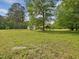 Expansive front yard view encompassing the home, outdoor shelter, and a sense of peaceful living at 9652 S Nc-87 Hwy, Graham, NC 27253